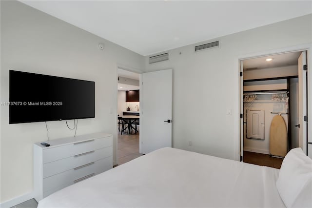 bedroom with a walk in closet