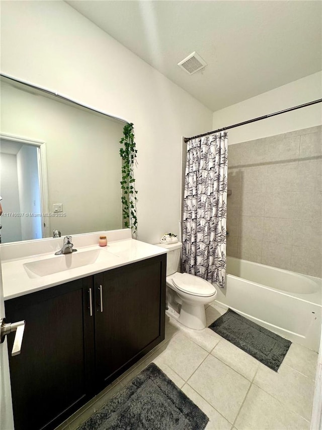 full bathroom with vanity, shower / tub combo with curtain, tile patterned floors, and toilet