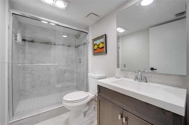 bathroom with vanity, toilet, and walk in shower