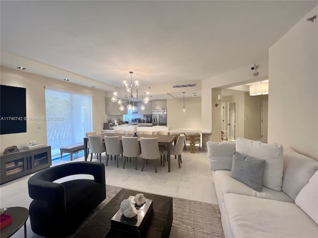 living room featuring a notable chandelier