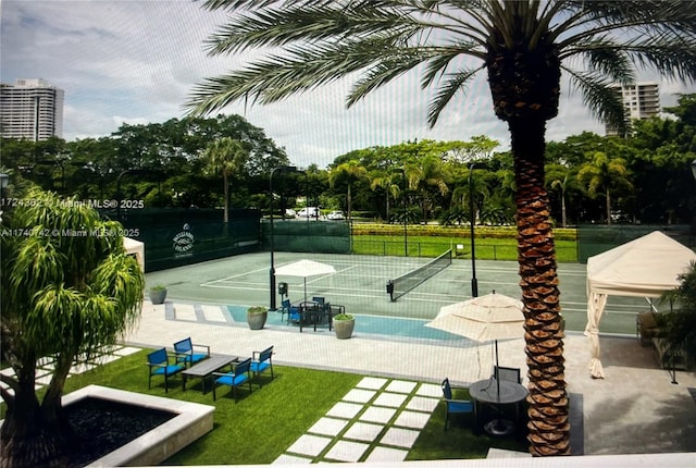 surrounding community with tennis court