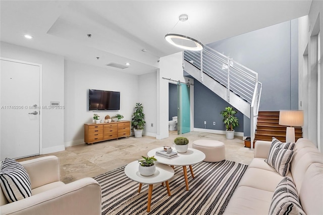 living room featuring a barn door