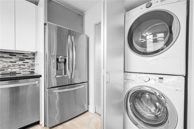 laundry room with stacked washer and dryer