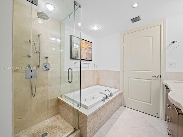 bathroom with vanity, tile patterned floors, and shower with separate bathtub