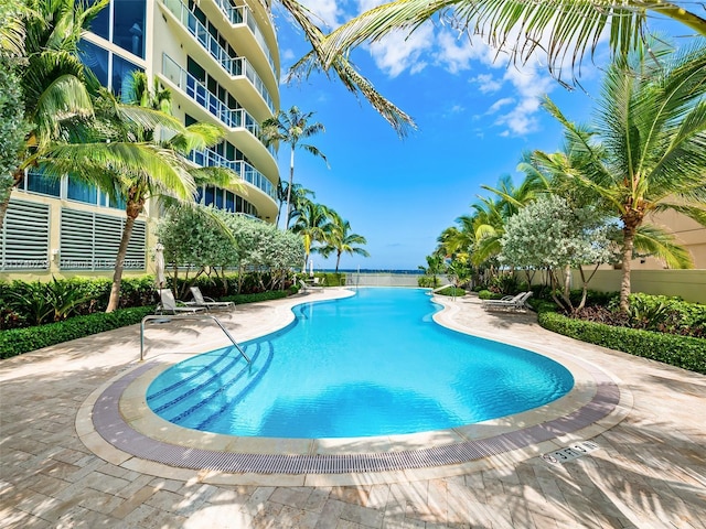 view of swimming pool with a patio