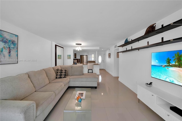 3750 NE 170th St Unit 101, North Miami Beach, FL 33160 - living room with light tile patterned flooring and baseboards