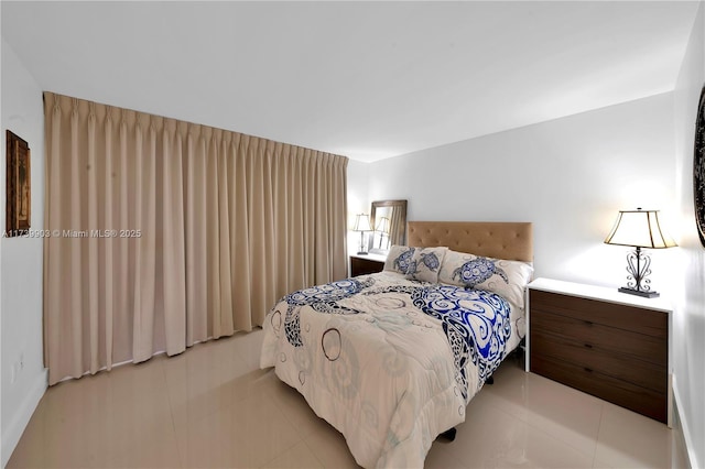 3750 NE 170th St Unit 101, North Miami Beach, FL 33160 - bedroom featuring light tile patterned flooring
