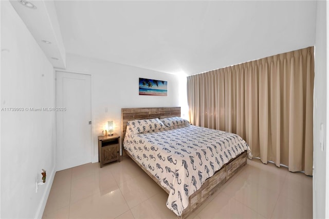 bedroom featuring light tile patterned floors