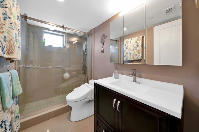 bathroom featuring a shower with door, vanity, tile patterned flooring, and toilet