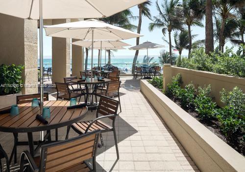 view of patio / terrace featuring a balcony and a water view