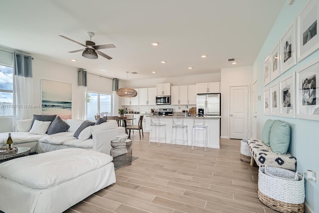 living room featuring ceiling fan