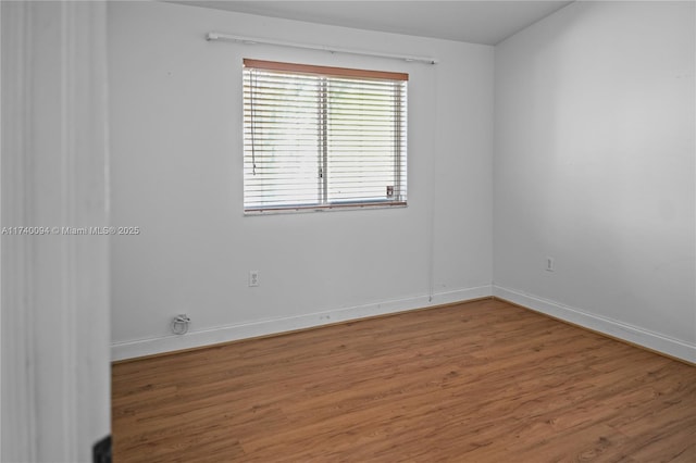 empty room featuring wood-type flooring