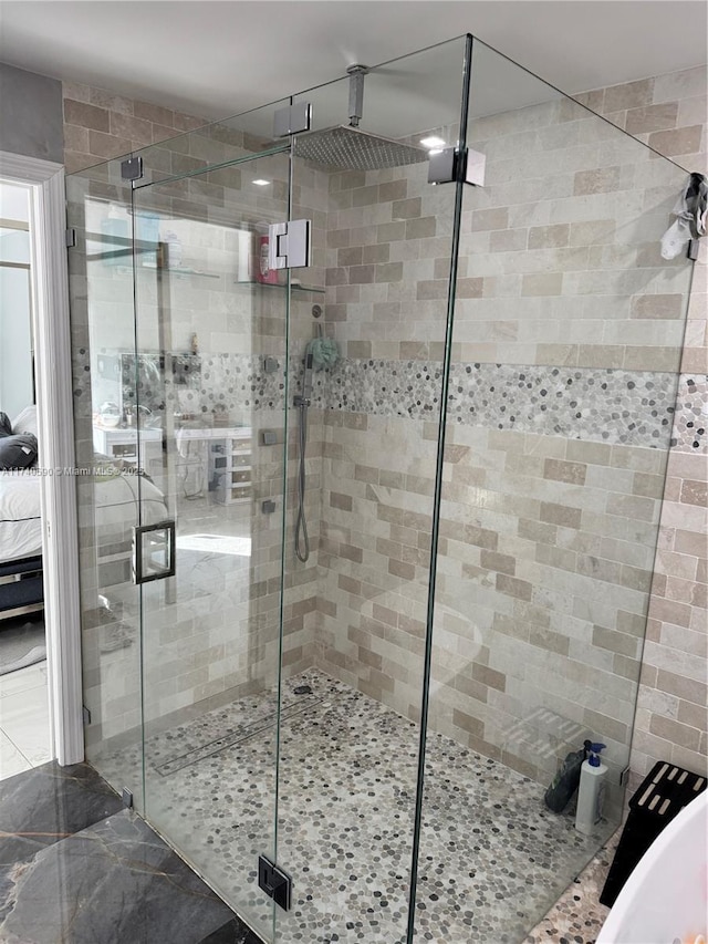 bathroom with a shower with shower door