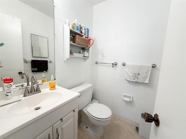 bathroom with vanity, toilet, and tile patterned flooring