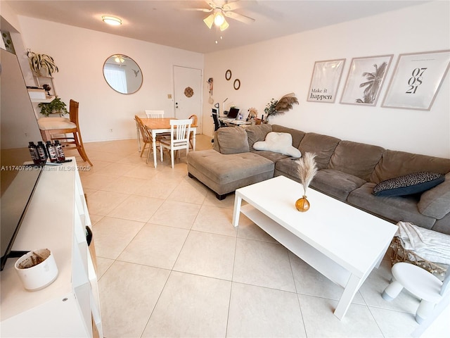 tiled living room with ceiling fan