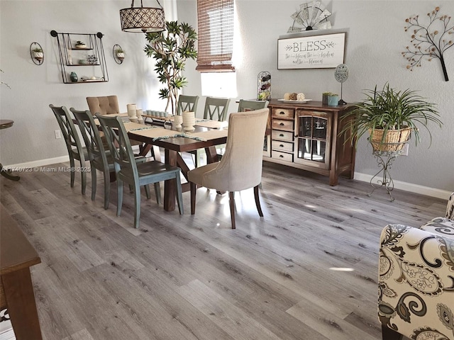 dining space featuring hardwood / wood-style flooring