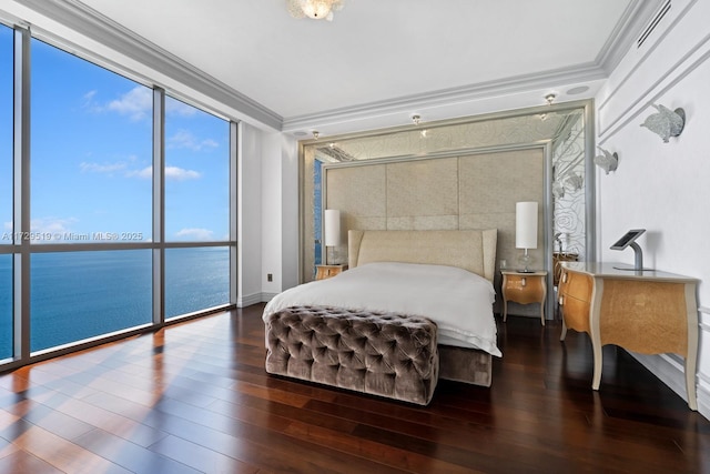 bedroom featuring crown molding, a water view, dark hardwood / wood-style floors, and a wall of windows