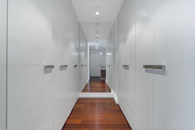 hallway featuring dark hardwood / wood-style flooring