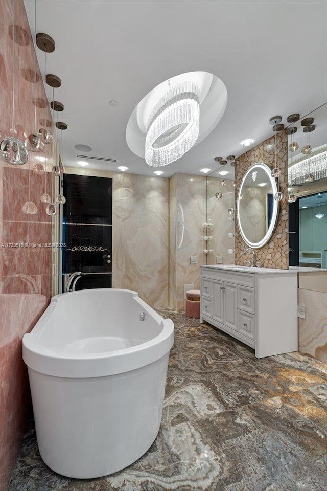 bathroom featuring vanity, independent shower and bath, and tile walls