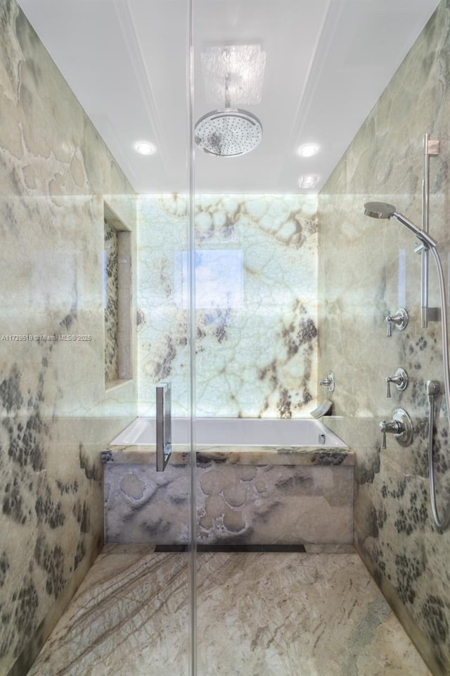 bathroom featuring shower with separate bathtub