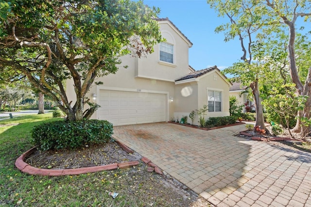 view of front of home with a garage