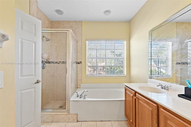 bathroom featuring vanity, tile patterned floors, and independent shower and bath