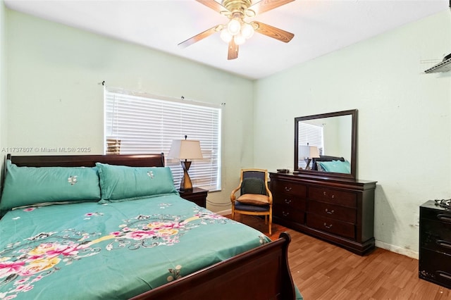 bedroom featuring light hardwood / wood-style flooring and ceiling fan