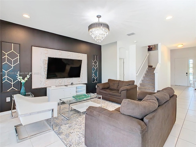 living room with light tile patterned flooring and a chandelier