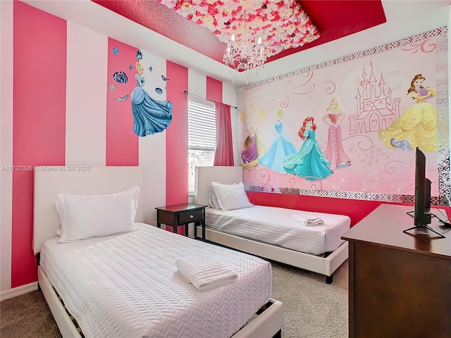 carpeted bedroom featuring an inviting chandelier