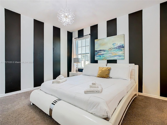 bedroom featuring carpet floors and a chandelier