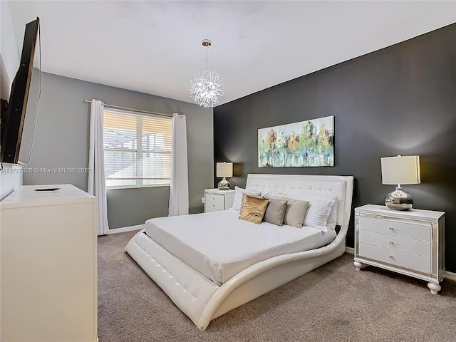 carpeted bedroom with a chandelier