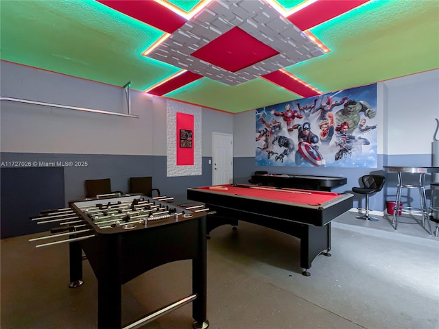 game room featuring concrete floors