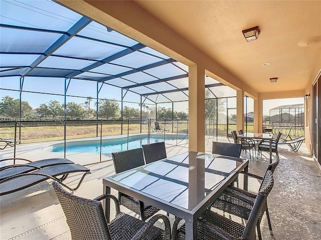 view of patio / terrace with a lanai