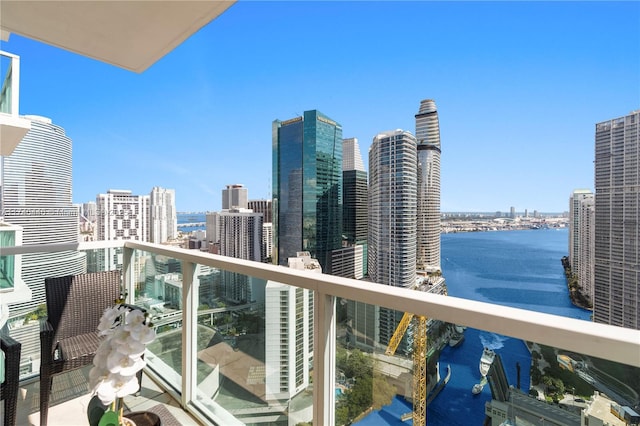 balcony featuring a water view