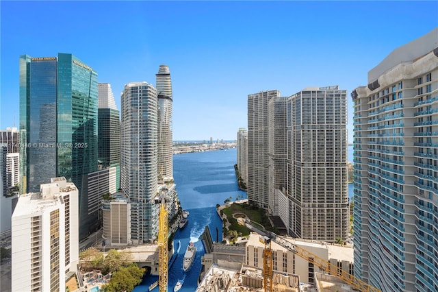 property's view of city featuring a water view