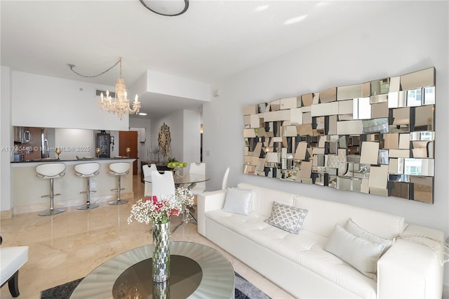 living room with an inviting chandelier