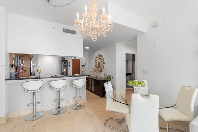 dining space featuring a chandelier