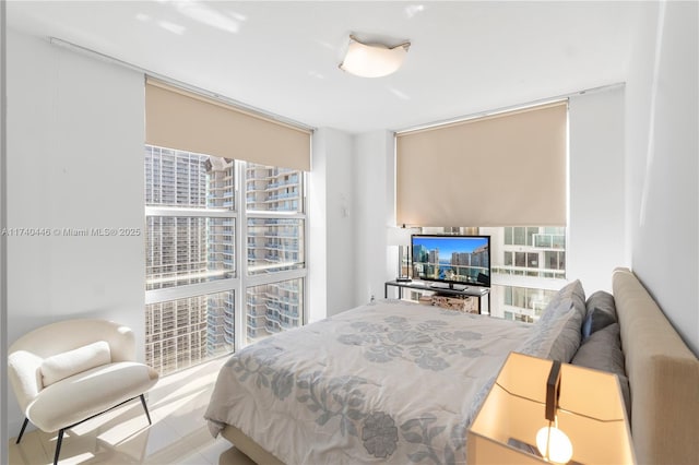 bedroom featuring a wall of windows