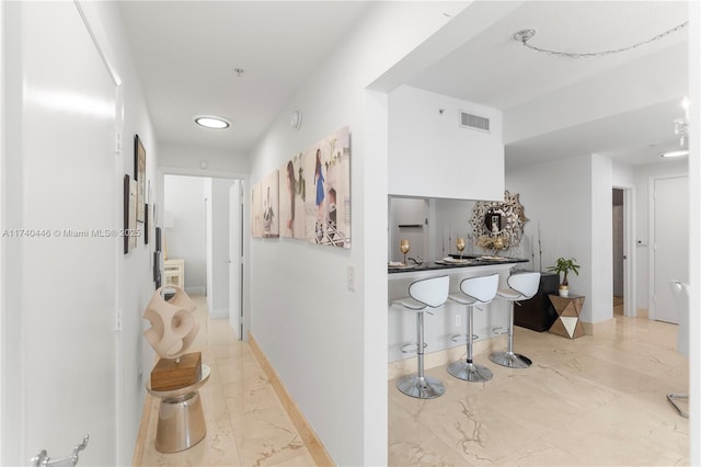 31 SE 5th St Unit 4018, Miami, FL 33131 - hall with light marble finish flooring, recessed lighting, and baseboards