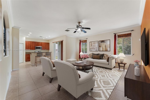 tiled living room with crown molding and ceiling fan