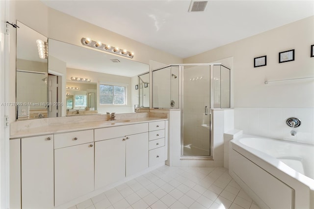 bathroom with tile patterned floors, plus walk in shower, and vanity