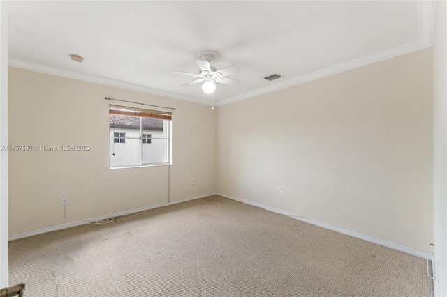 unfurnished room featuring ornamental molding, carpet flooring, and ceiling fan