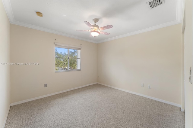 carpeted empty room with crown molding and ceiling fan