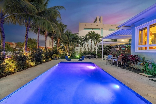 outdoor pool featuring a patio