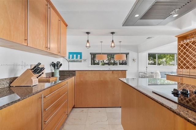 kitchen with pendant lighting, visible vents, ornamental molding, wall chimney range hood, and dark stone counters