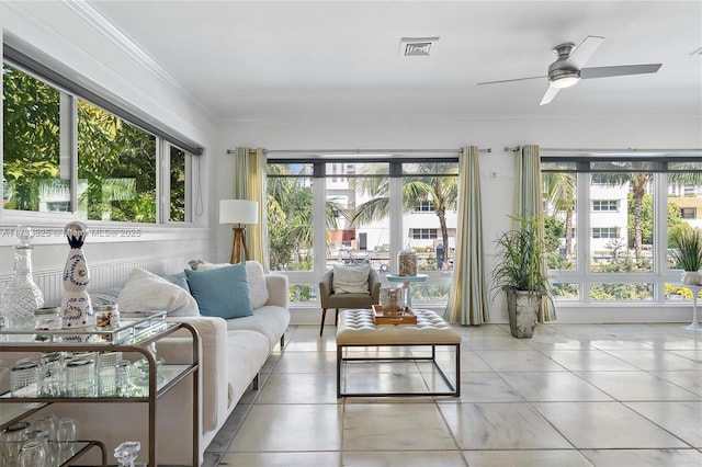 sunroom with visible vents and a ceiling fan