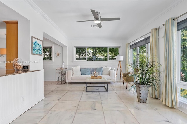 sunroom / solarium featuring ceiling fan