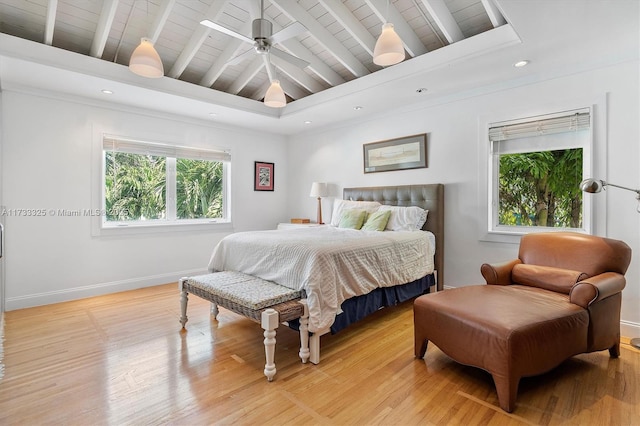 bedroom featuring light wood finished floors, baseboards, lofted ceiling with beams, wooden ceiling, and recessed lighting