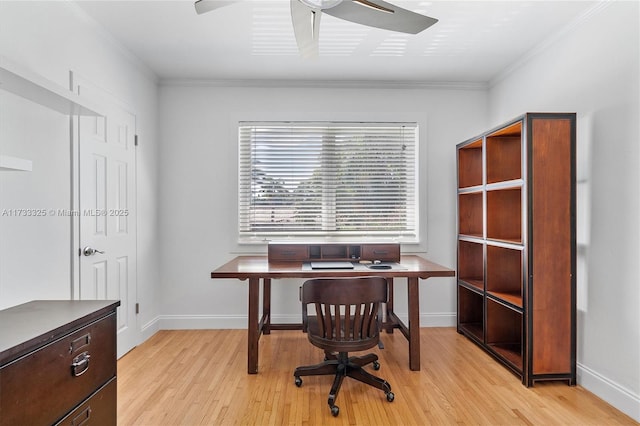 office featuring light wood finished floors, ornamental molding, and baseboards