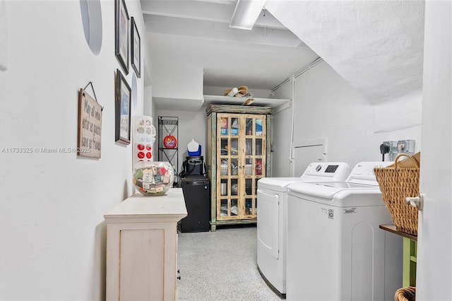 washroom with independent washer and dryer